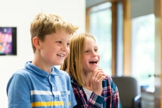 A boy and a girl laughing
