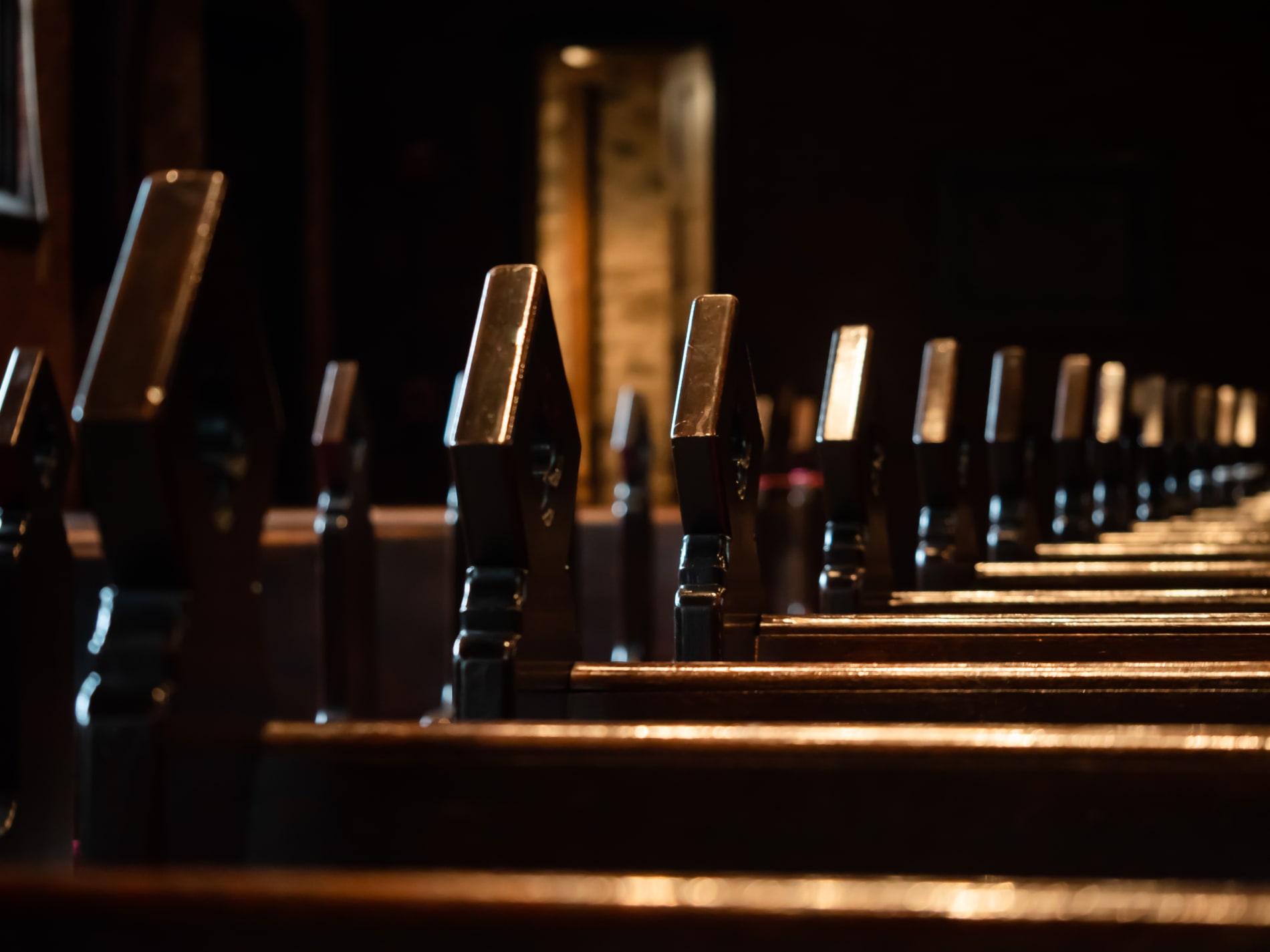 Wooden carved finials on church pews
